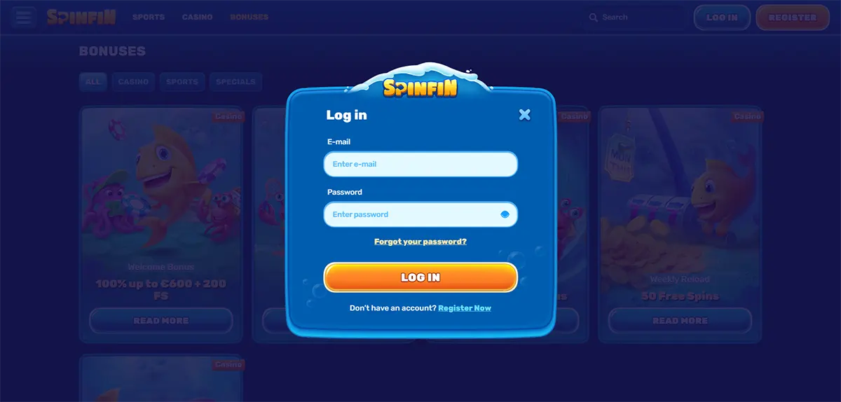 Login modal for Spinfin Casino featuring email and password input fields, a “Forgot your password?” link, a prominent “LOG IN” button, and a registration prompt, all styled in a rounded blue UI overlay with a blurred casino background